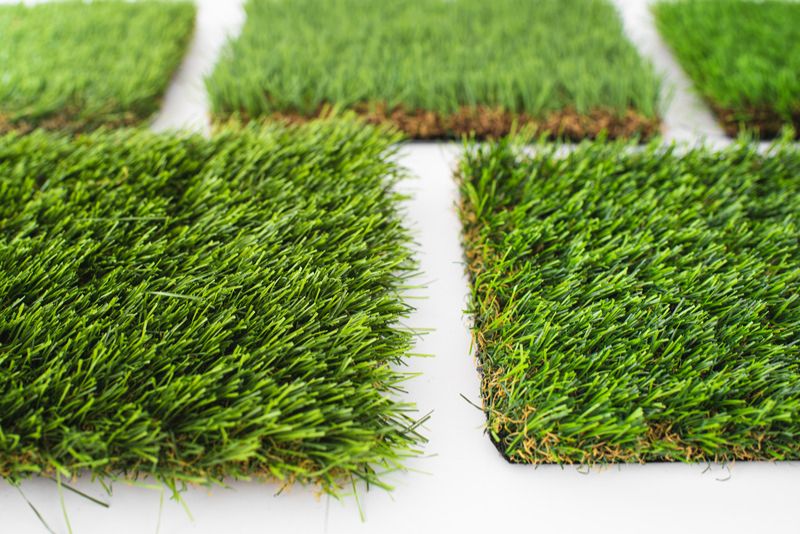 Rolled synthetic grass sheets ready for installation