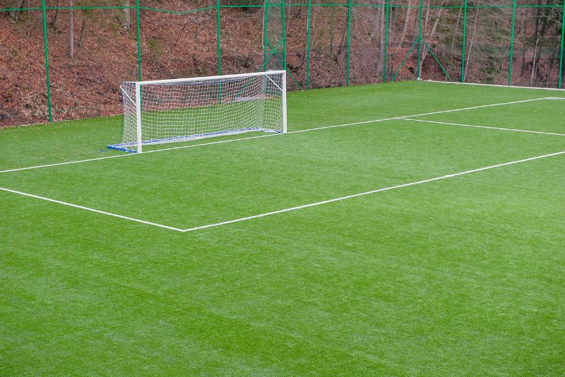 Synthetic grass surface on a sports ground playing field