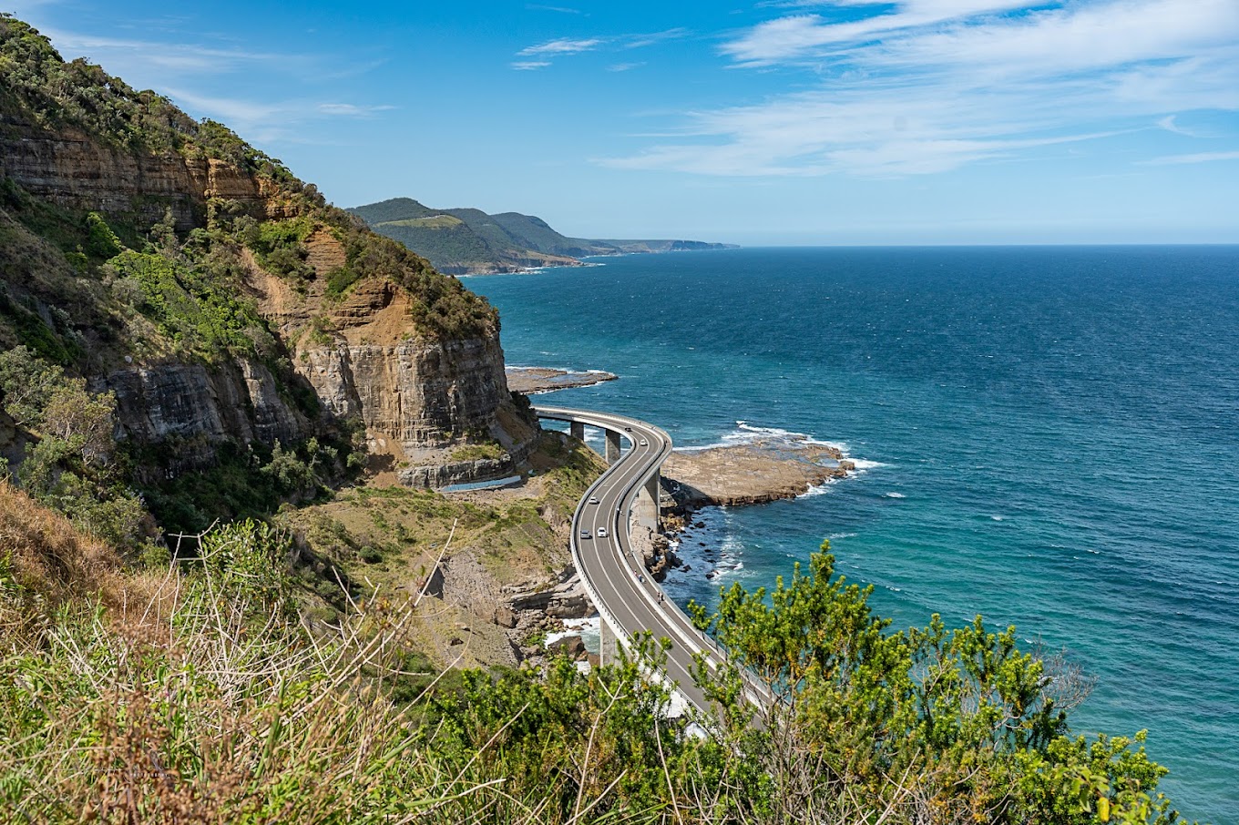 Pedestrian walkway along Sea Cliff Bridge overlooking the ocean