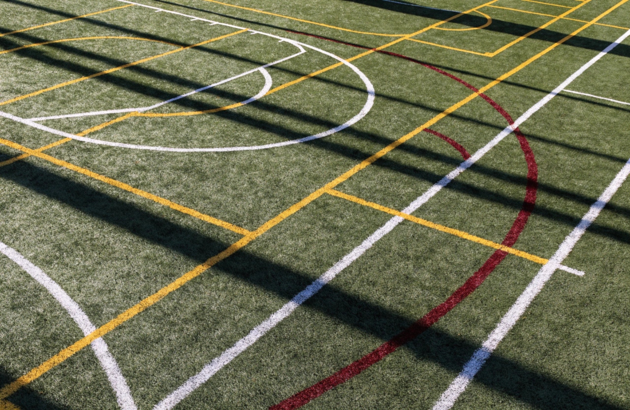 Multi-sport synthetic turf surface with basketball and soccer line markings