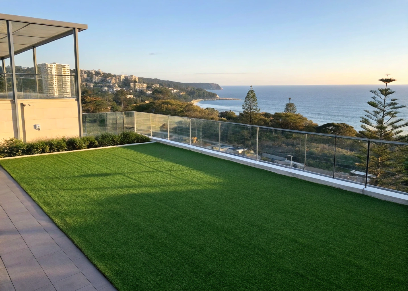 Rooftop artificial lawn common area with an ocean view in Wollongong