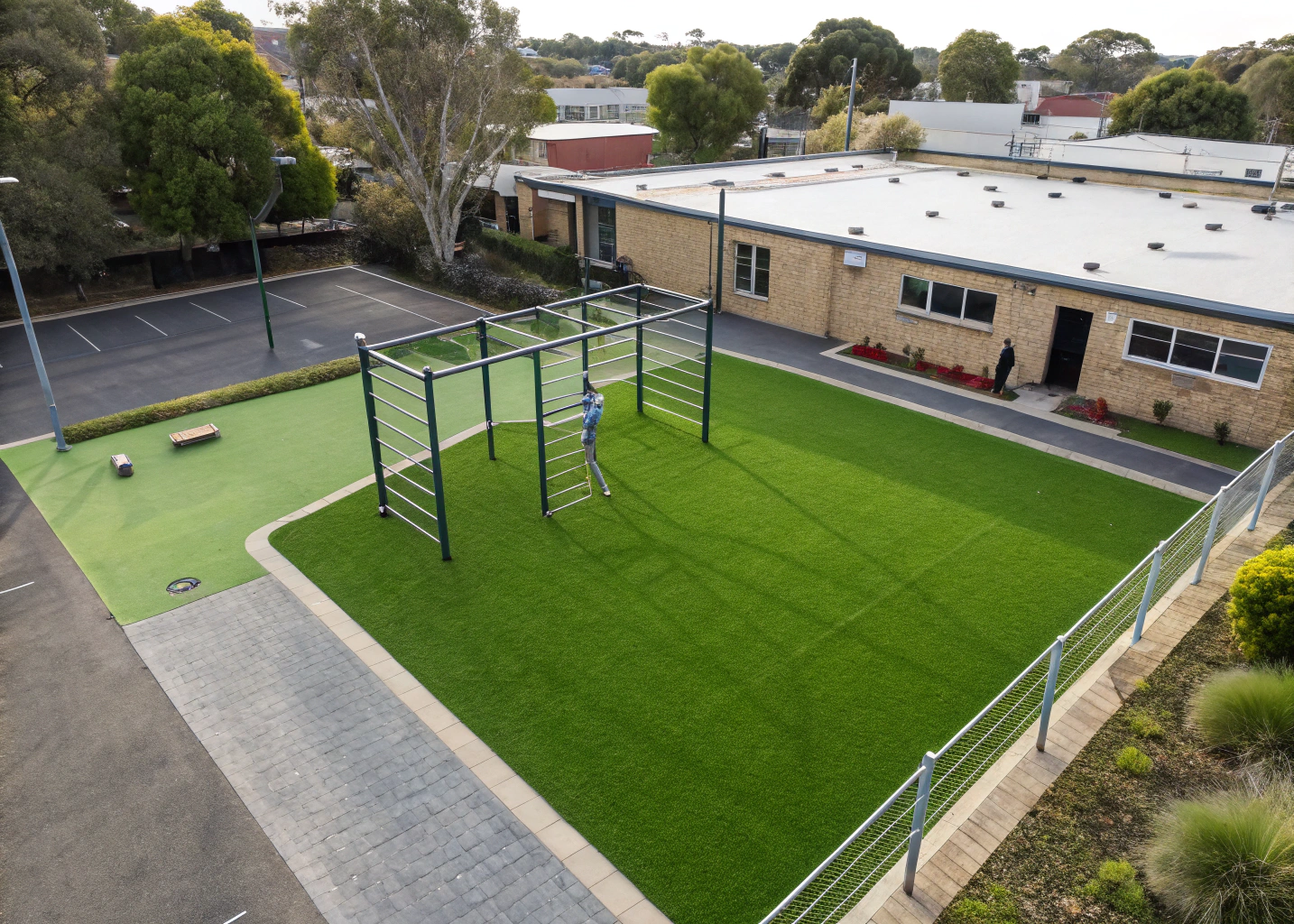 Synthetic grass soft fall surface installed around a climbing frame at a Wollongong primary school